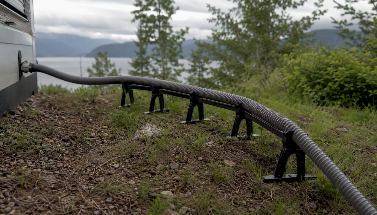 RV sewer hose on support at campsite