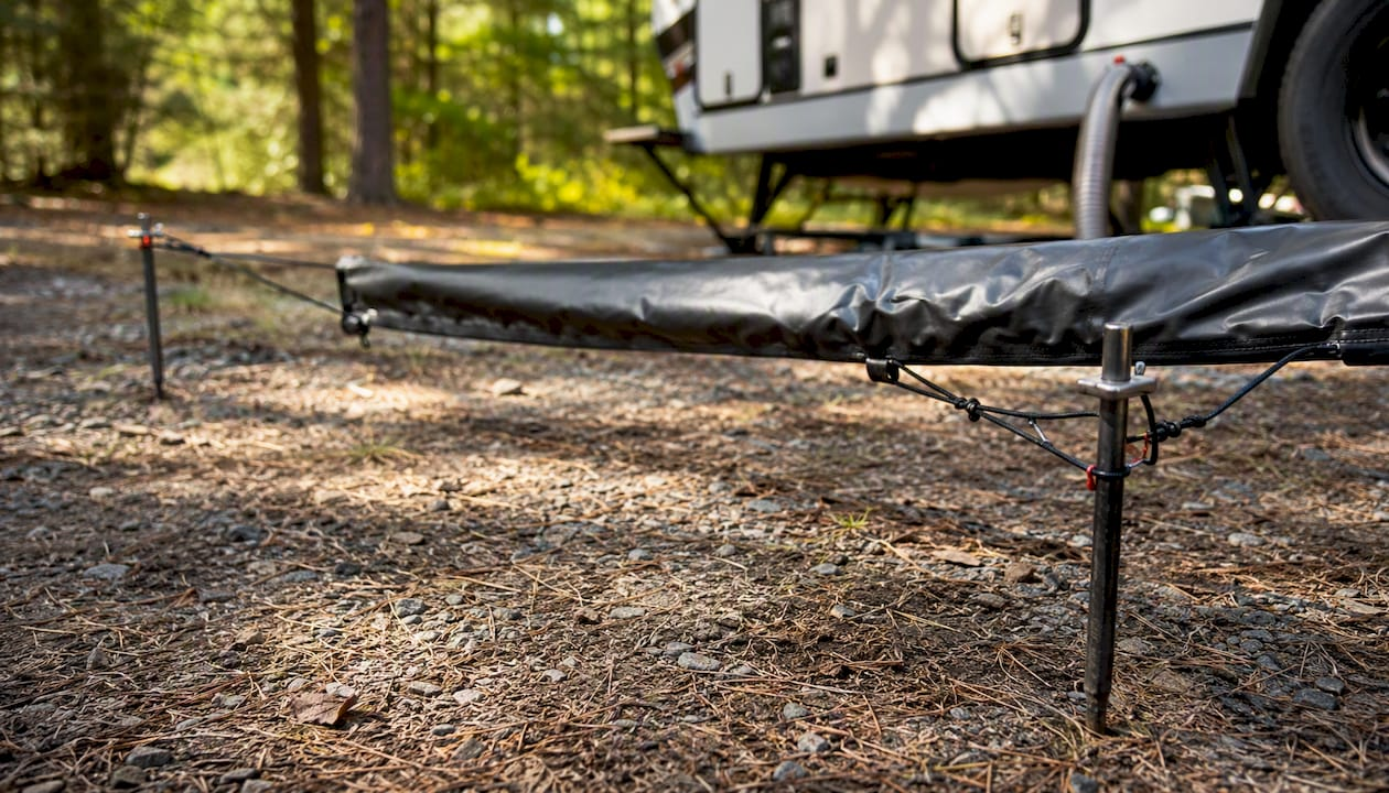 Modular RV sewer hose support setup at campsite